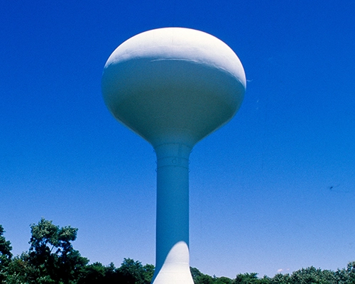 water tower against blue sky. Pace services for utilities.